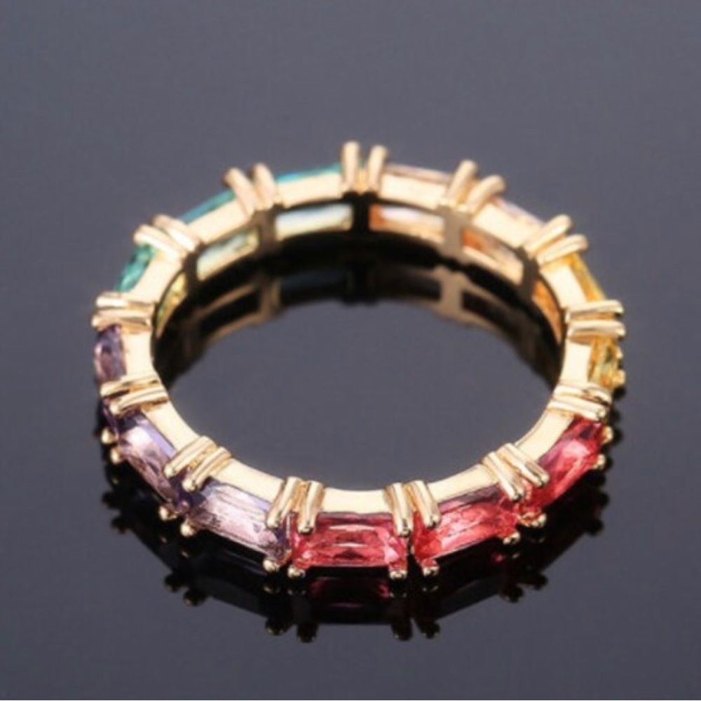 NWOT. Multicolor sapphire around gold plated brass ring.Size 7.
